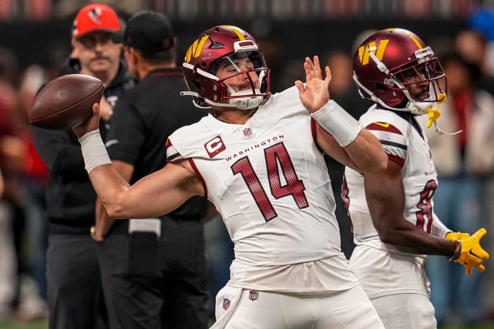Washington Commanders quarterback Sam Howell (14) warms up on the field prior to the game against the Atlanta Falcons at Mercedes-Benz Stadium. Mandatory Credit: Dale Zanine-USA TODAY Sports
